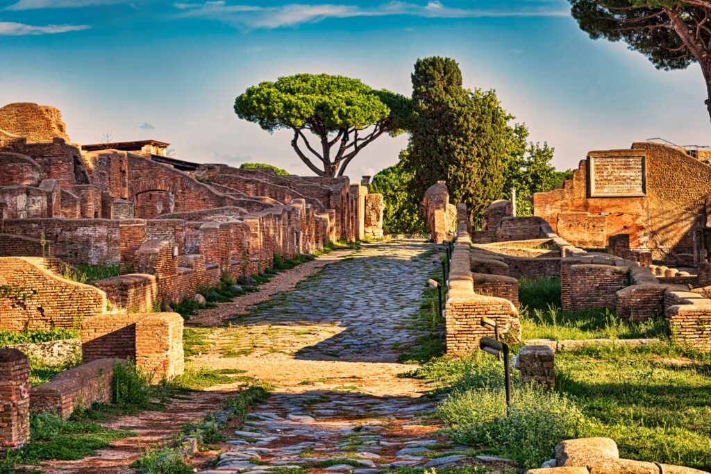 Archaeological Roman ruin street view in Ostia antica, a beautiful travel archaeology destination with well preserved ancient Rome ruins in ancient Ostia in Rome - Italy