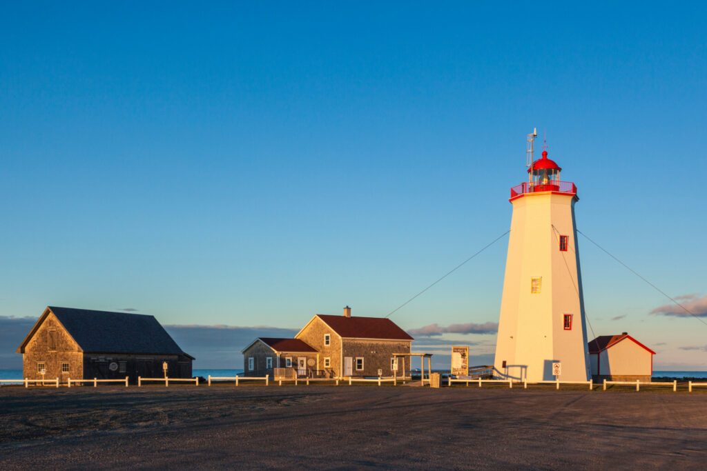 Canada, New Brunswick, Miscou Island. Miscou Lighthouse at sunset.