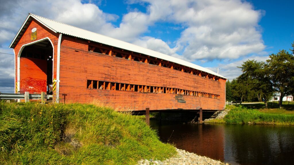 Vertical shot of orange covered Champagne Bridge, near Val-d'Or, Abitibi-Temiscamingue, Quebec