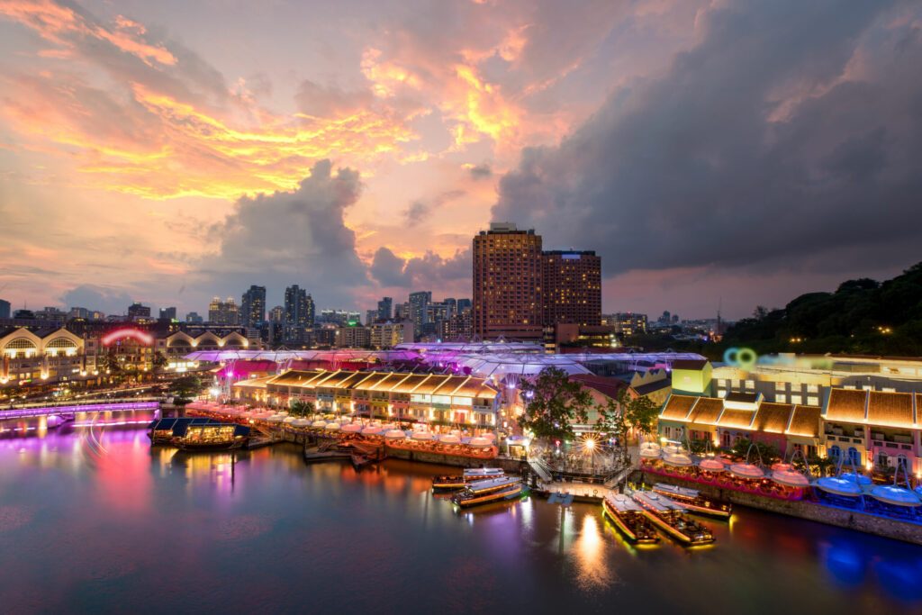 Colorful light building at night in Clarke Quay, Singapore. Clarke Quay, is a historical riverside quay in Singapore.