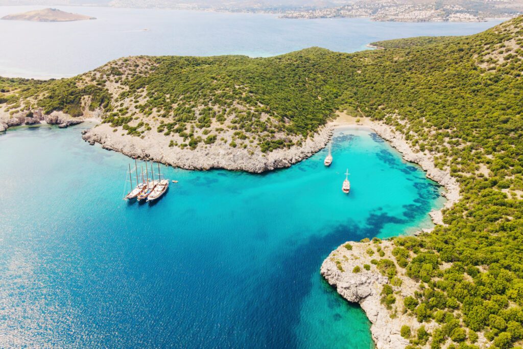 Aerial shot with yachts resting in beautiful Akvaryum koyu in Bodrum, Turkey