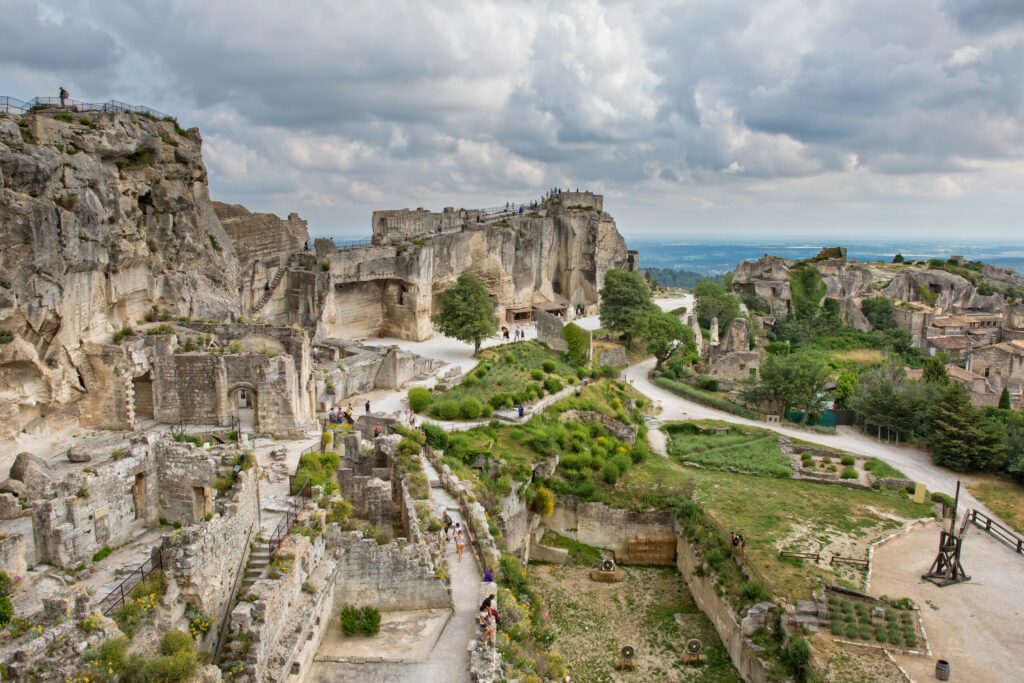 Aerial view to medieval fortress Les Baux de Provence.Tourists visit the castle at Baux-de-Provence.Les Baux relying on a reputation as one of the most picturesque villages in France, Bouches-du-Rhône