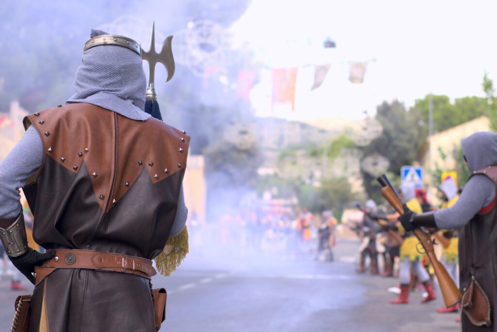 Moors and christians. Back turned christian sergeant in blunderbuss fight with copy space. Moros y cristianos typical fest in Spain. High quality photo