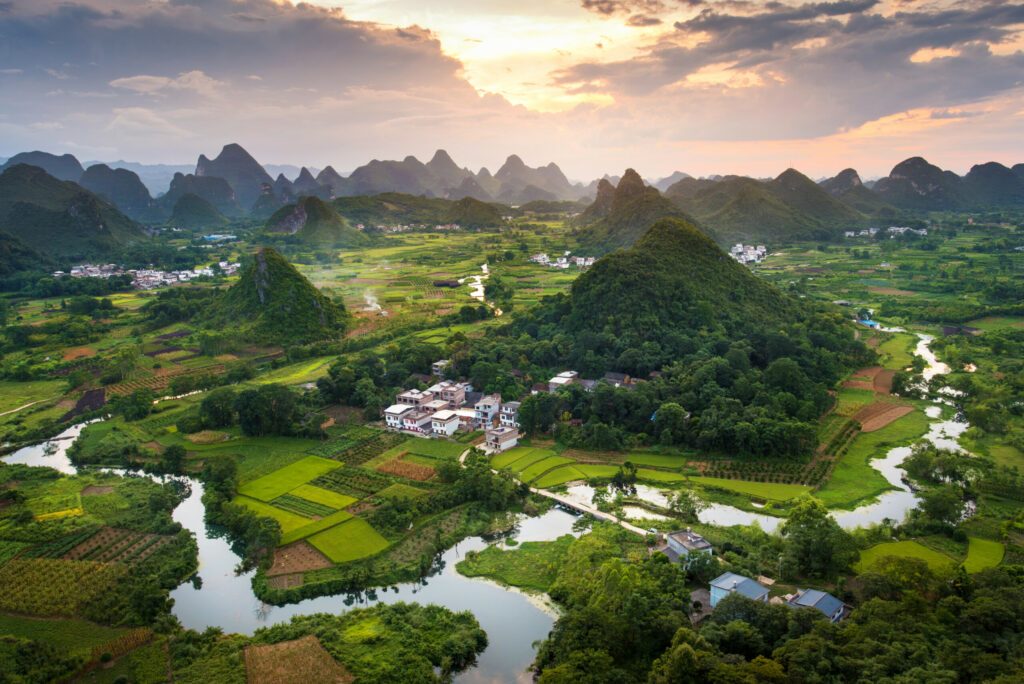 Stunning sunset over karst formations landscape near Yangshuo China