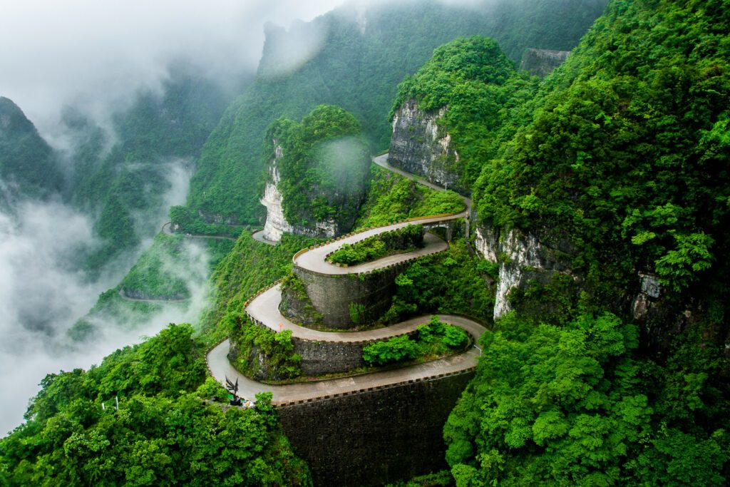 The winding road of Tianmen mountain national park (Zhangjiajie) in clouds mist, Hunan province, China