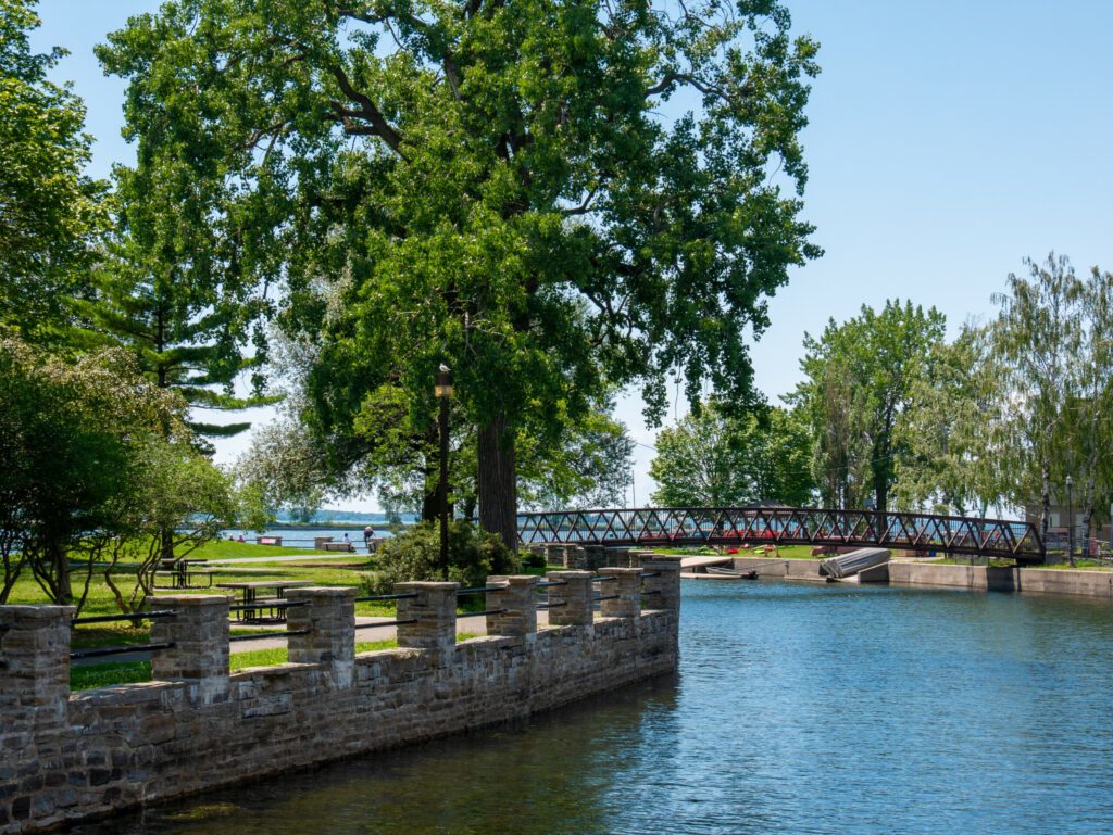 Lachine canal water scenic view of environmental friendly suburbia rich in green trees. Lachine, Quebec, Canada