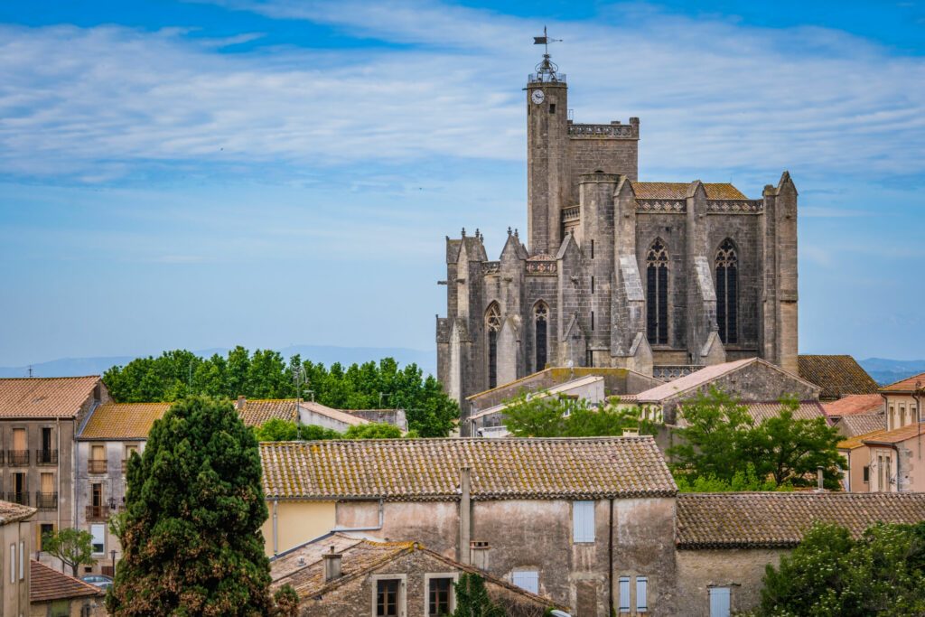 View on the gothic Saint Etienne collegiate church in the village of Capestang in the south of France (Herault)