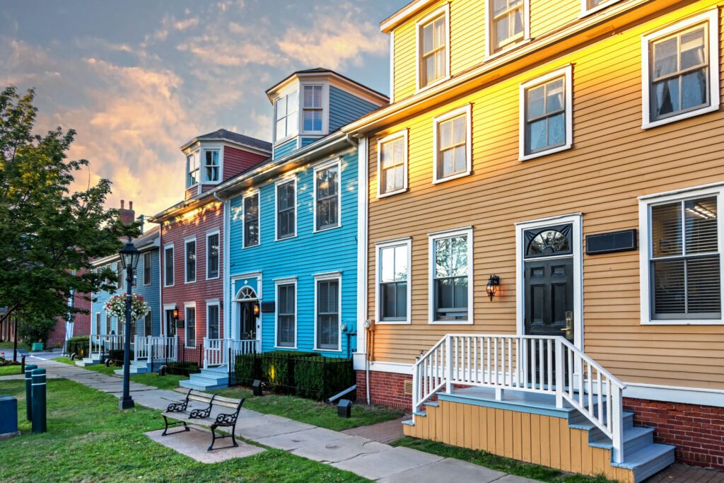 The sun sets on a row of the colorful Victorian clapboard houses in Charlottetown, capital of Prince Edward Island, Canada