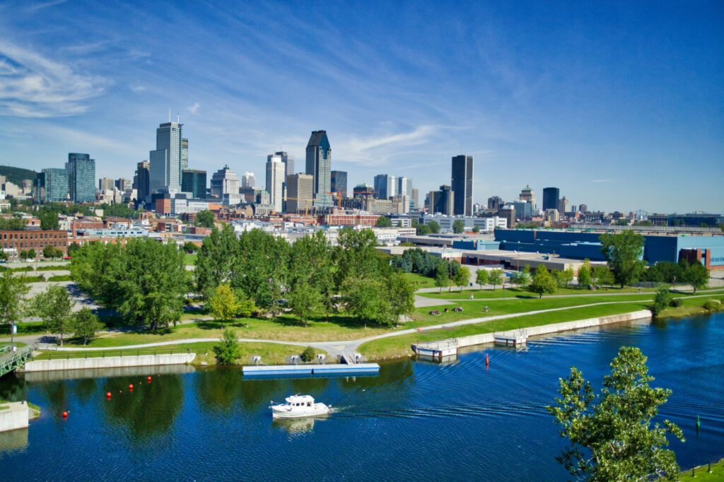 Montreal skyline with yacht in foreground in the Lachine Canal