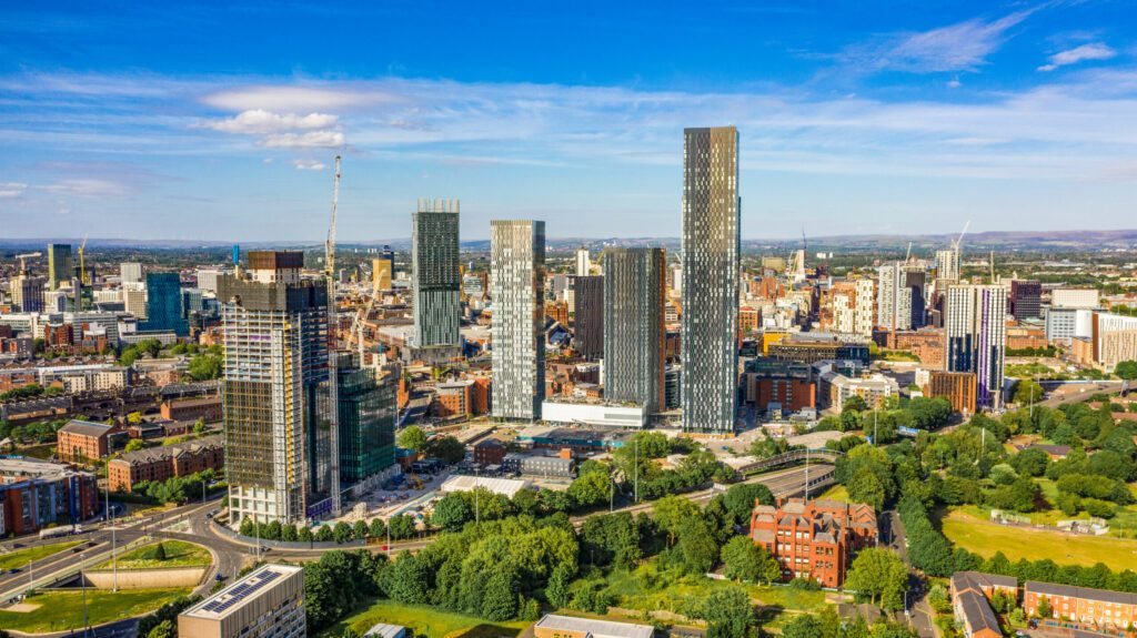 Aerial shot of Manchester UK on a beautiful summer day during pandemic lock-down