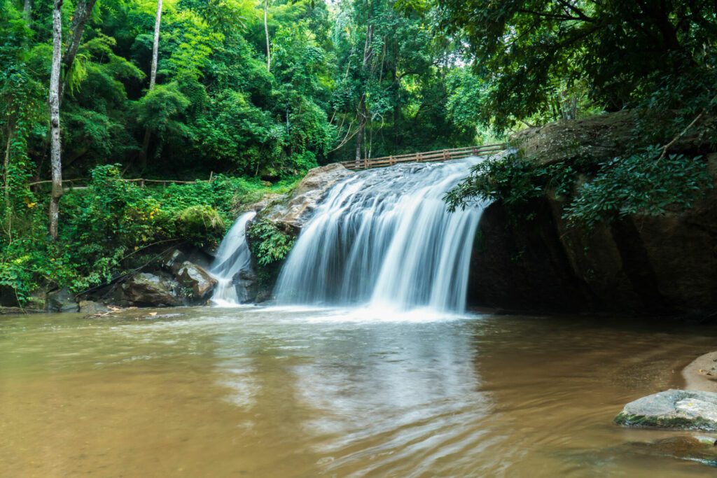 Mae Sa waterfall in Chiang Mai, Thailand. Beautiful Maesa waterfall in cool day light with green trees in Chiangmai province, Thai