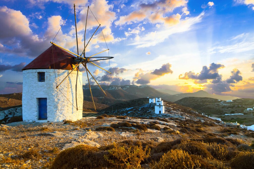 beautiful sunset over windmills. Amorgos island, Greece