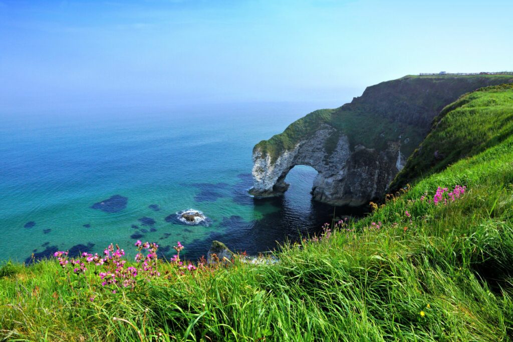 Wishing Arch along coastline of white cliffs, Causeway Coast, Northern Ireland