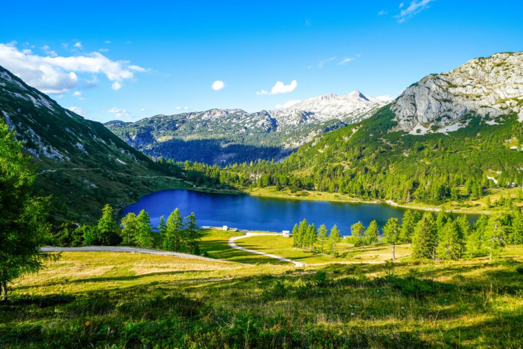 Großsee on the high plateau of the Tauplitzalm. View of the lake at the Toten Gebirge in Styria. Idyllic landscape with mountains and a lake on the Tauplitz.